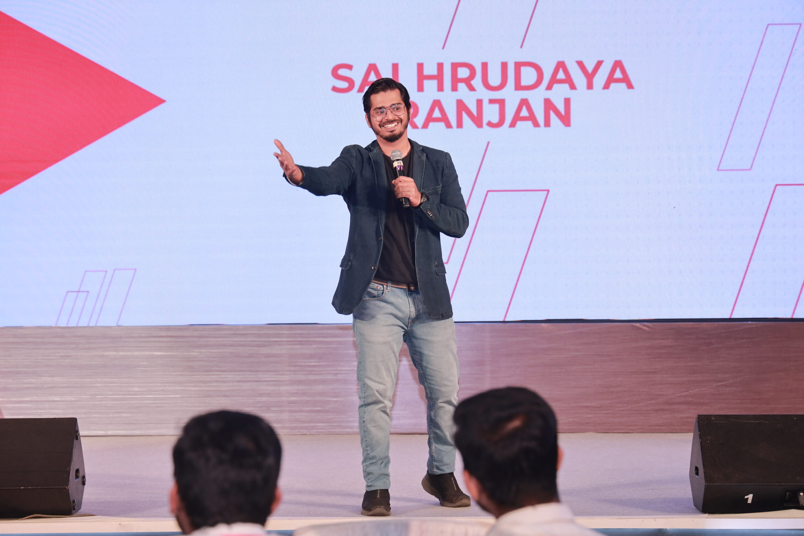 Comedian Hriday Ranjan performing at a corporate event in Coimbatore