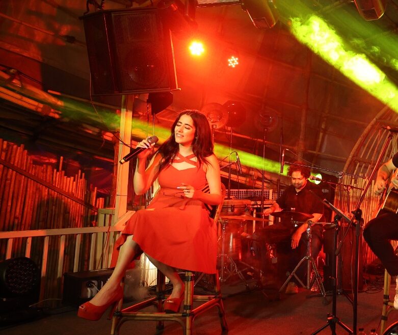 Jonita Gandhi performing at a corporate event in Goa