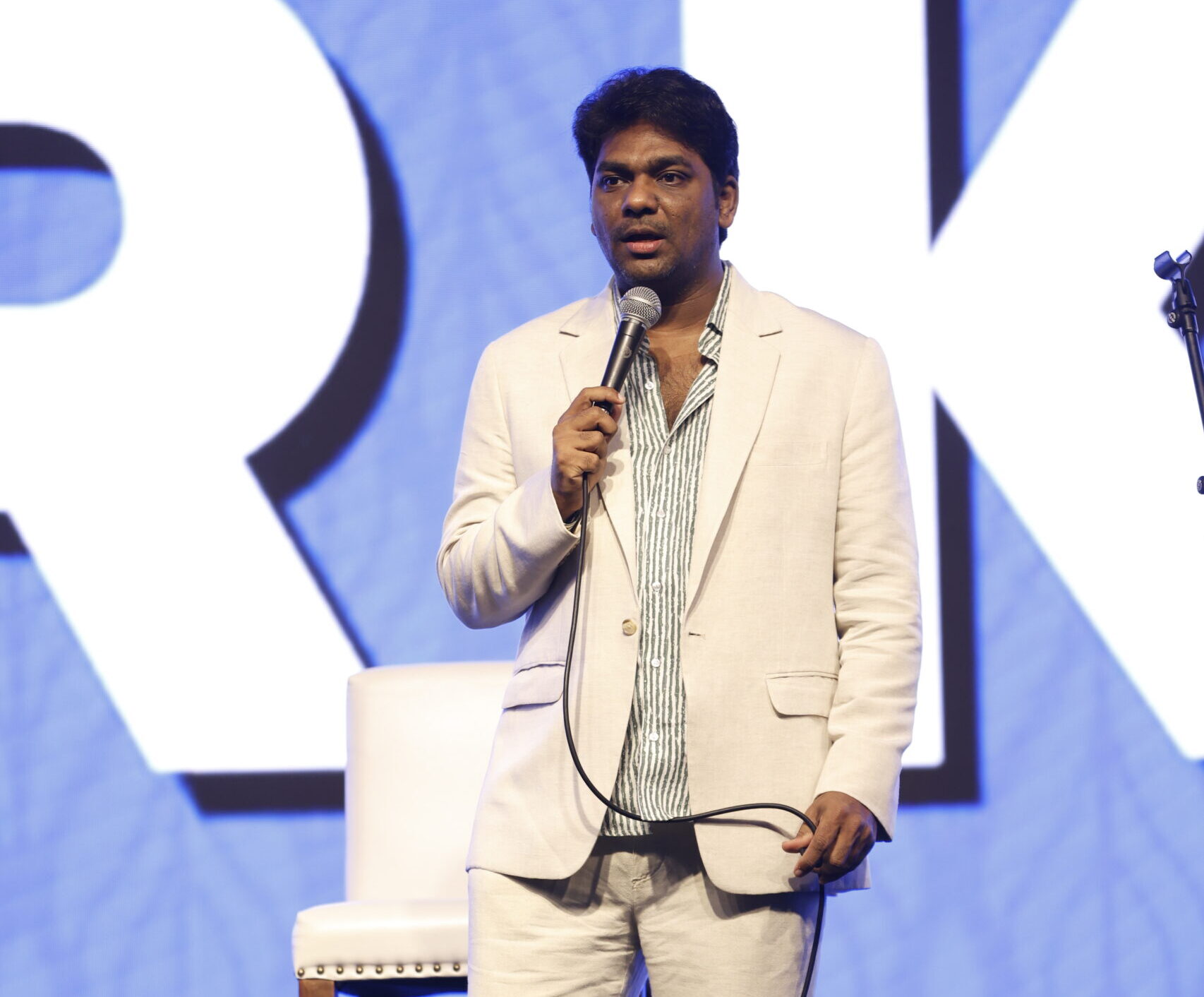 Zakir Khan performing at an awards and gala night event for a corporate event in Pune