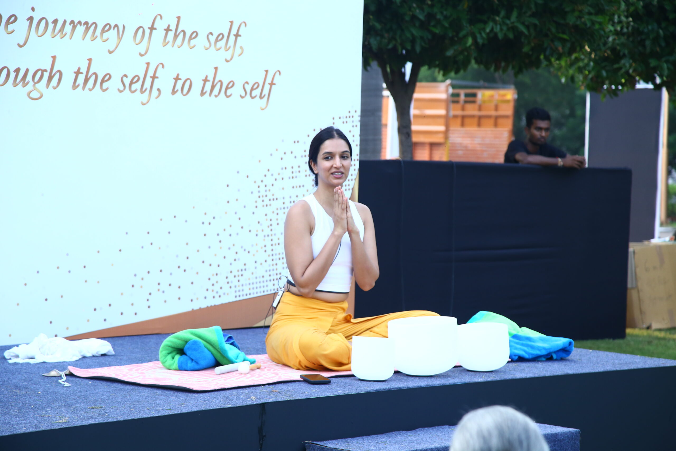 Ira Trivedi conducting a Yoga session at a corporate event in Delhi