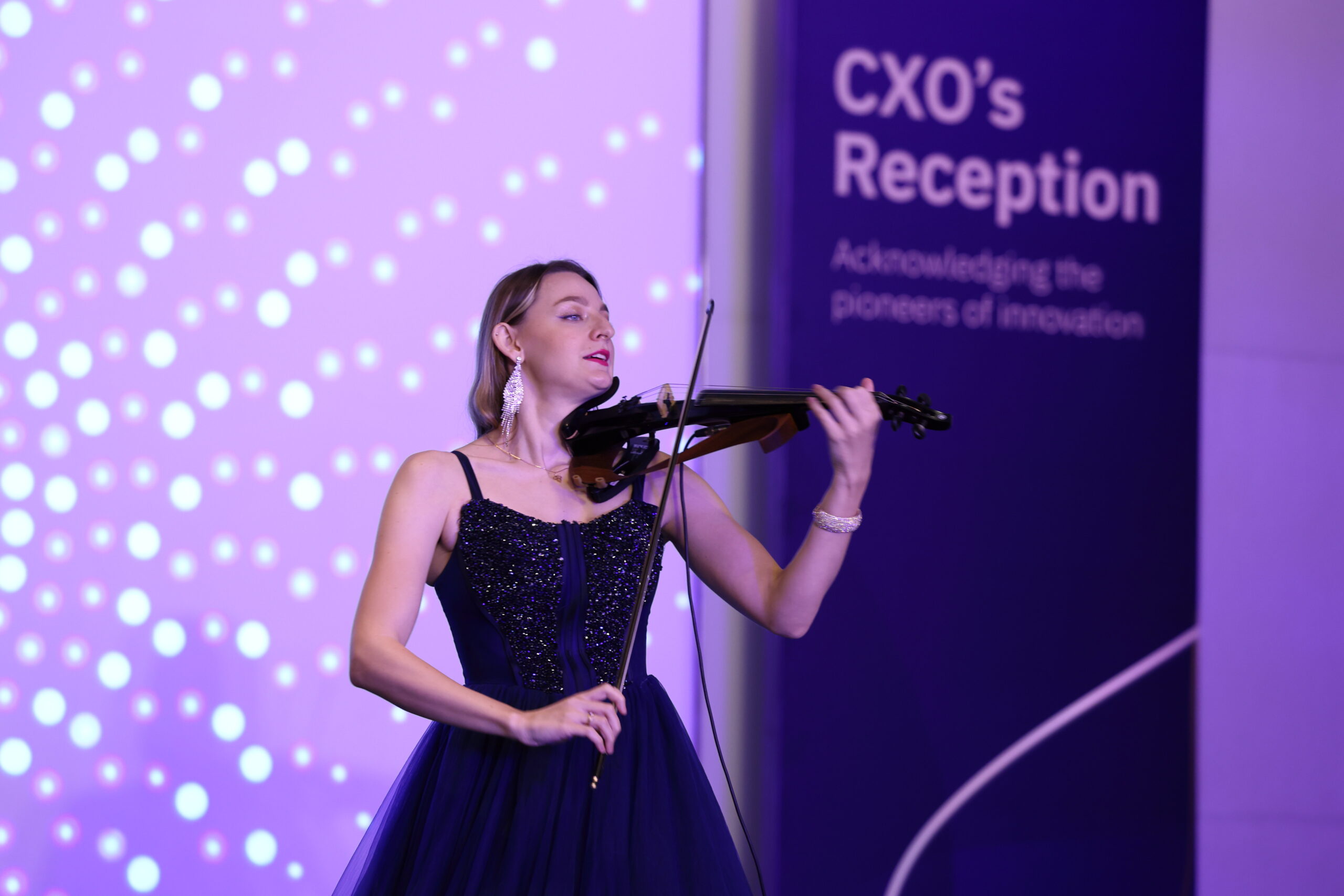 Violinist Ivaana performing at a corporate event in Mumbai