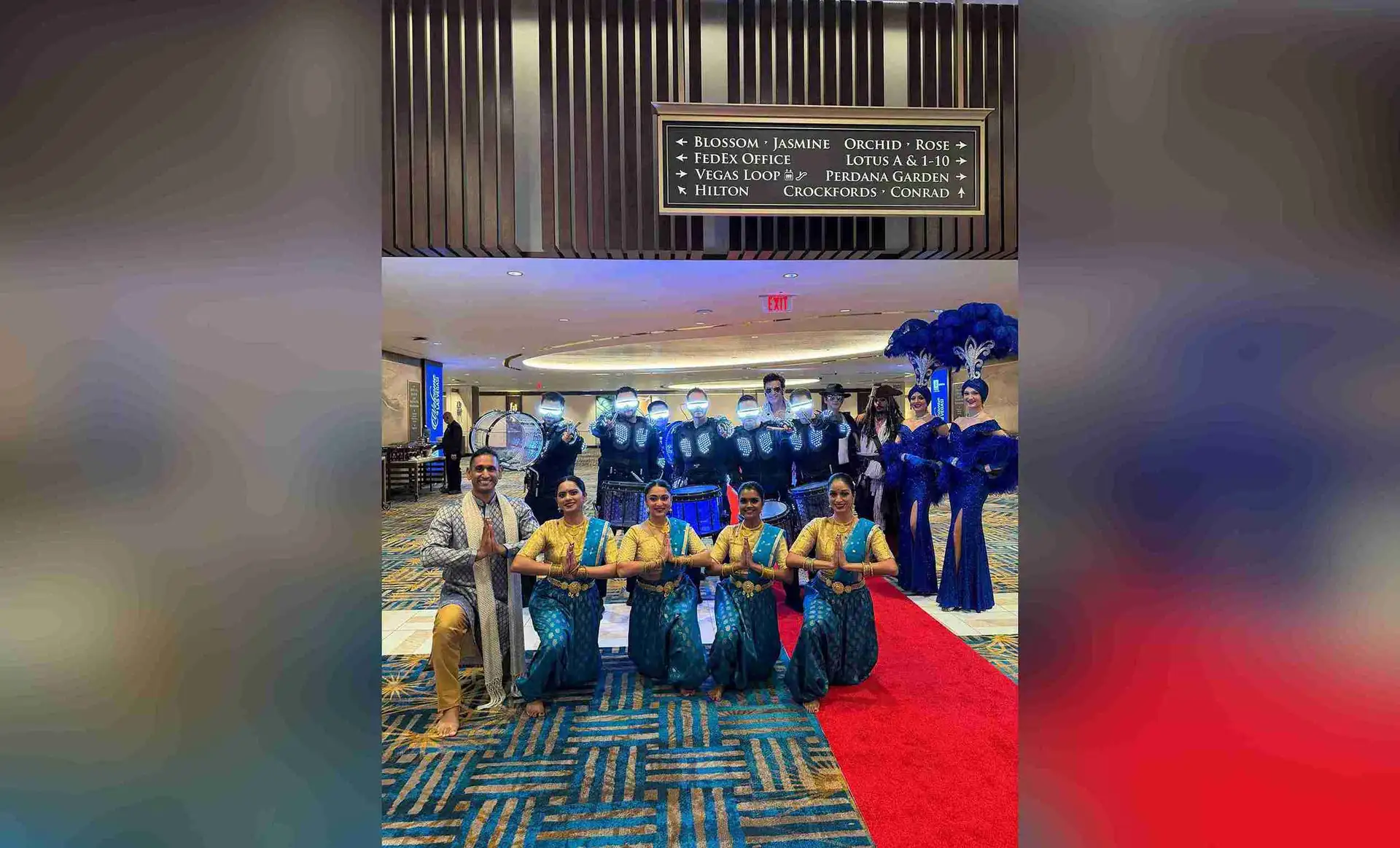 A marching band and a dance group performing at a corporate event in Las Vegas