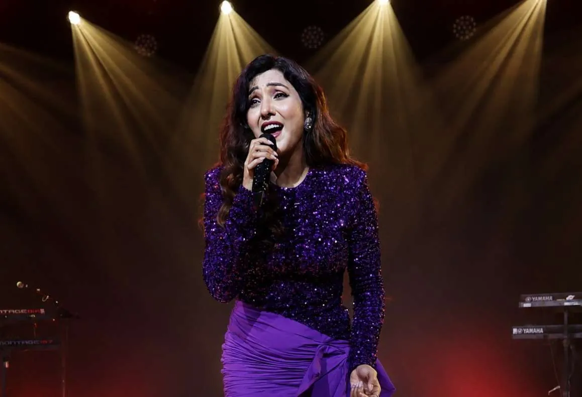 Singer Neeti Mohan performing at a corporate event in Goa