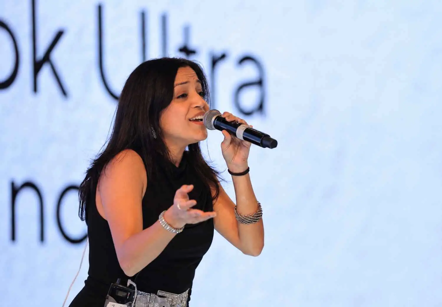 Singer Aneesha Das performing at a corporate event in Delhi