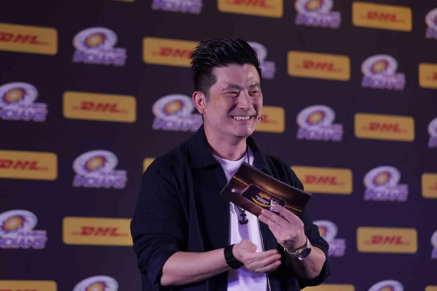 Meiyang Chang hosting a corporate event in Delhi