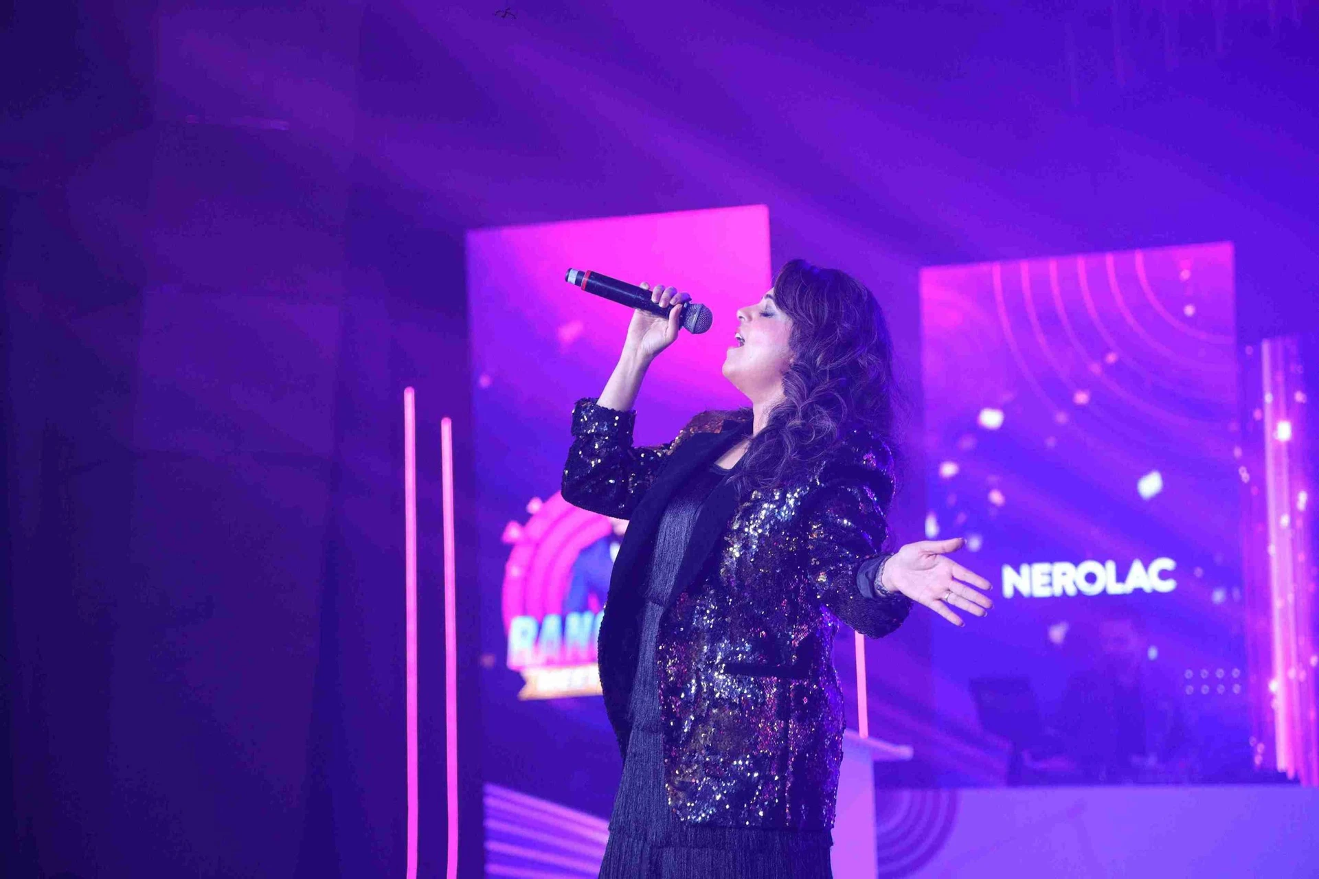 Sugandha Mishra performing at a corporate event in Mumbai