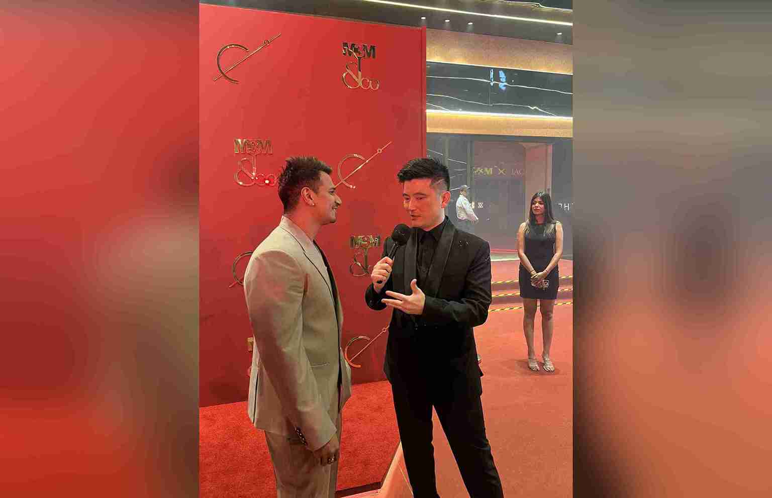 Meiyang Chang hosting a corporate event in Delhi