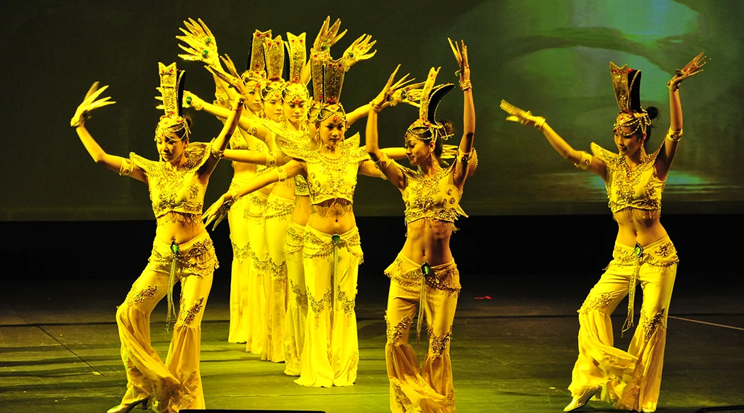 A dance group performing the Thousand hands of Buddha at a Dealers Meet for Exide in Macau