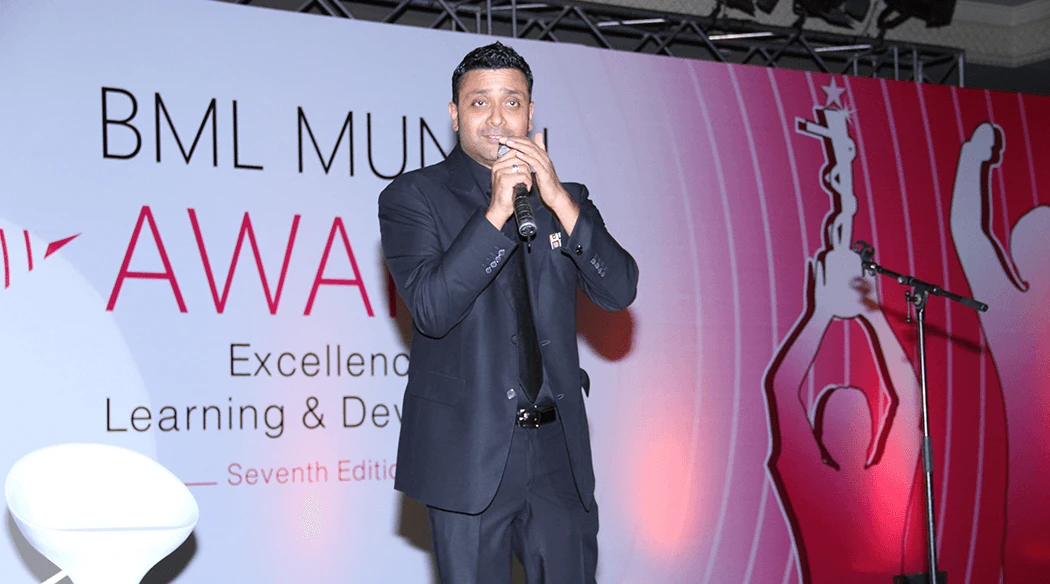 Ash Chandler performing at a corporate event in Delhi