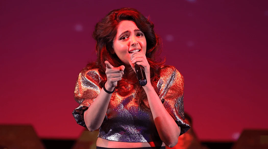 Sugandha Mishra performing at a corporate event in Goa