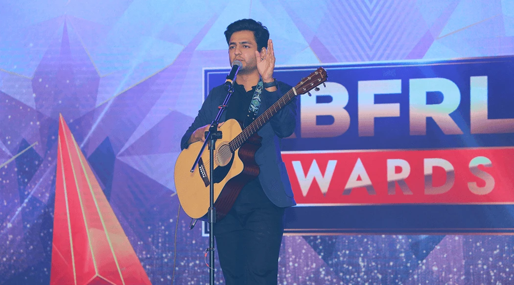 Kenneth Sebastian performing at a corporate event in Bangalore