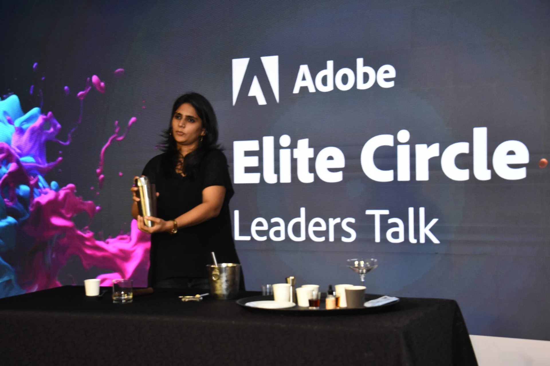Mixologist Arina Suchde conducting a team building activity at a corporate event in Mumbai