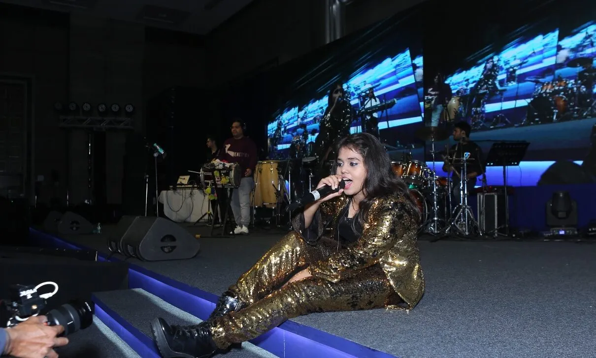 Shanmukha Priya performing at a sales conference in Delhi