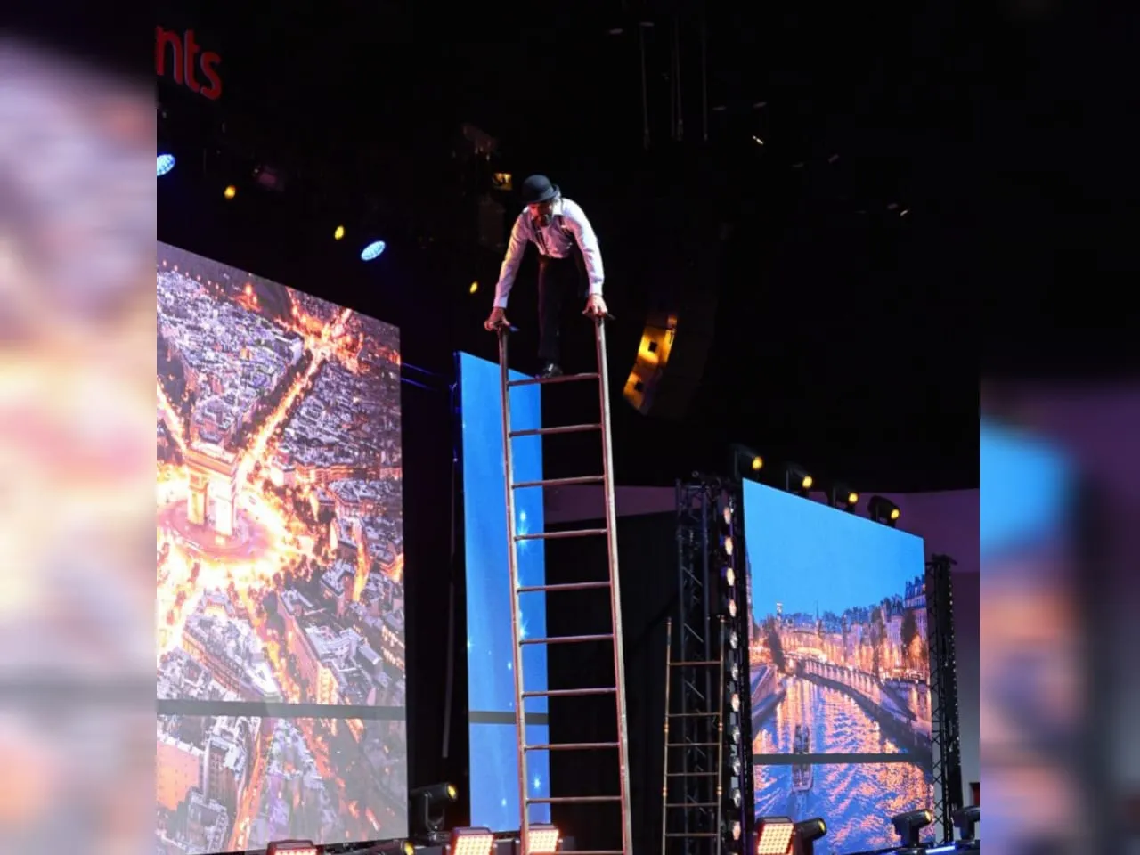 Ladderman Act at a corporate event in Paris