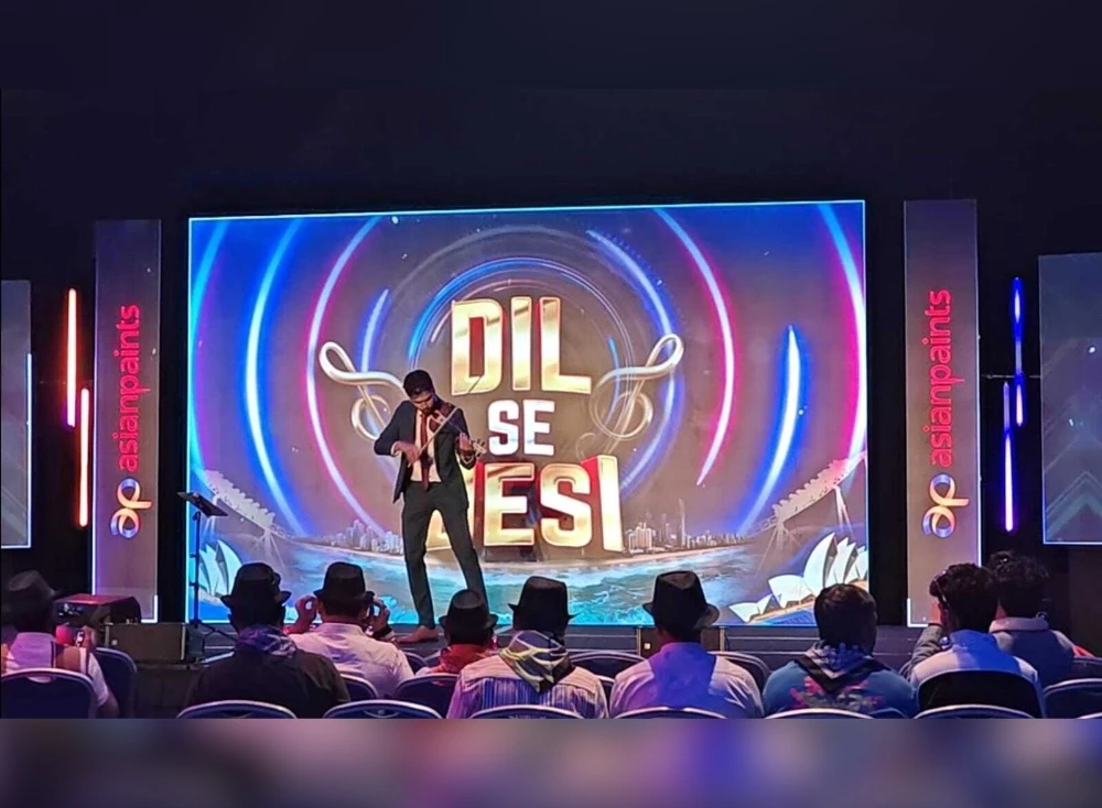 A violinist playing Bollywood tracks at an event for Asian Paints in Sydney