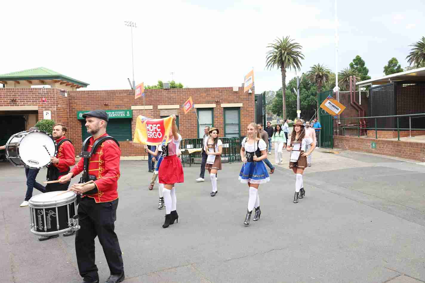 Drummers and themed hostesses welcoming guests at a corporate event in Sydney